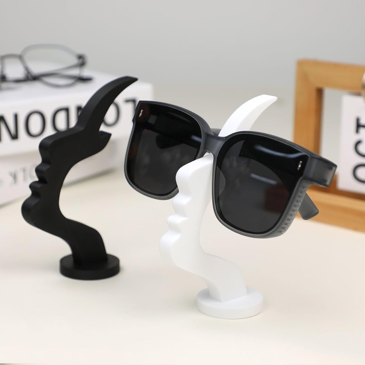 2Packs Modern Face Shaped Eyeglass Holder Stand Eyewear Display Rack Desktop Storage Organizer for Glasses Sunglasses 3D Printed Artistic Decor (black and white)