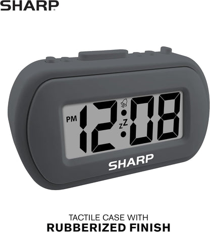 Sharp Battery Alarm Clock, Soft-Touch Case and Backlight, Charcoal Black | Soft-touch rubberized case; Battery operated; Blue backlight on demand; Ascending alarm; Snooze; Easy to use