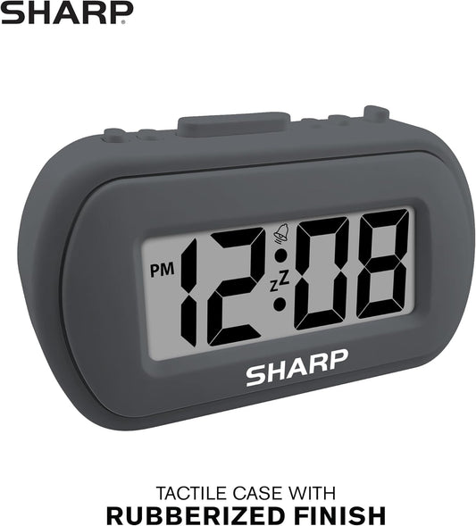 Sharp Battery Alarm Clock, Soft-Touch Case and Backlight, Charcoal Black | Soft-touch rubberized case; Battery operated; Blue backlight on demand; Ascending alarm; Snooze; Easy to use