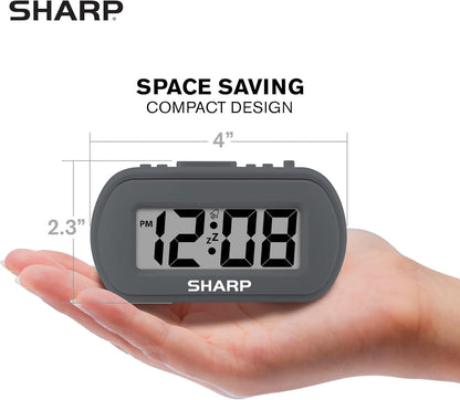Sharp Battery Alarm Clock, Soft-Touch Case and Backlight, Charcoal Black | Soft-touch rubberized case; Battery operated; Blue backlight on demand; Ascending alarm; Snooze; Easy to use