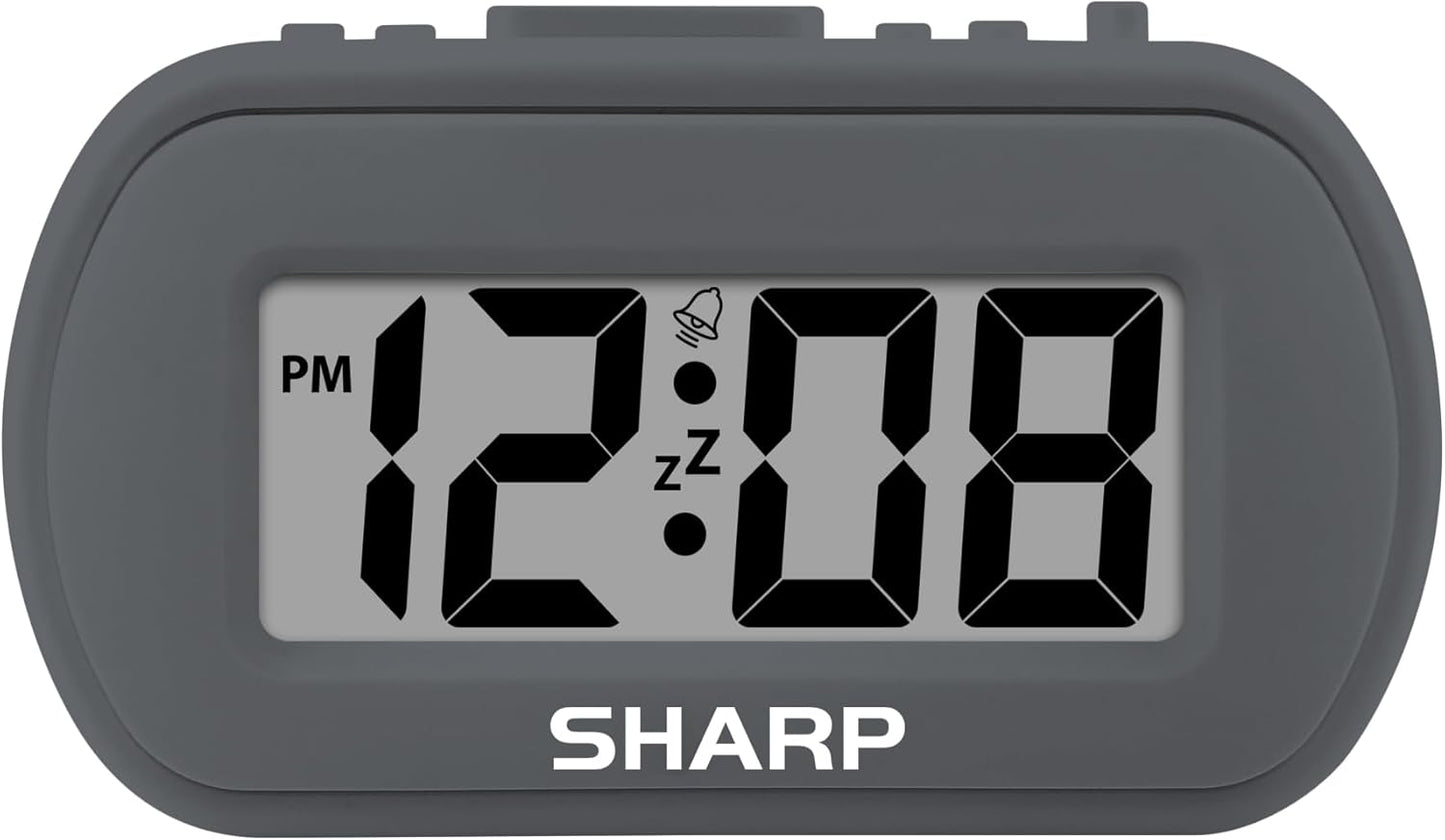 Sharp Battery Alarm Clock, Soft-Touch Case and Backlight, Charcoal Black | Soft-touch rubberized case; Battery operated; Blue backlight on demand; Ascending alarm; Snooze; Easy to use