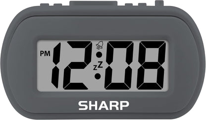 Sharp Battery Alarm Clock, Soft-Touch Case and Backlight, Charcoal Black | Soft-touch rubberized case; Battery operated; Blue backlight on demand; Ascending alarm; Snooze; Easy to use