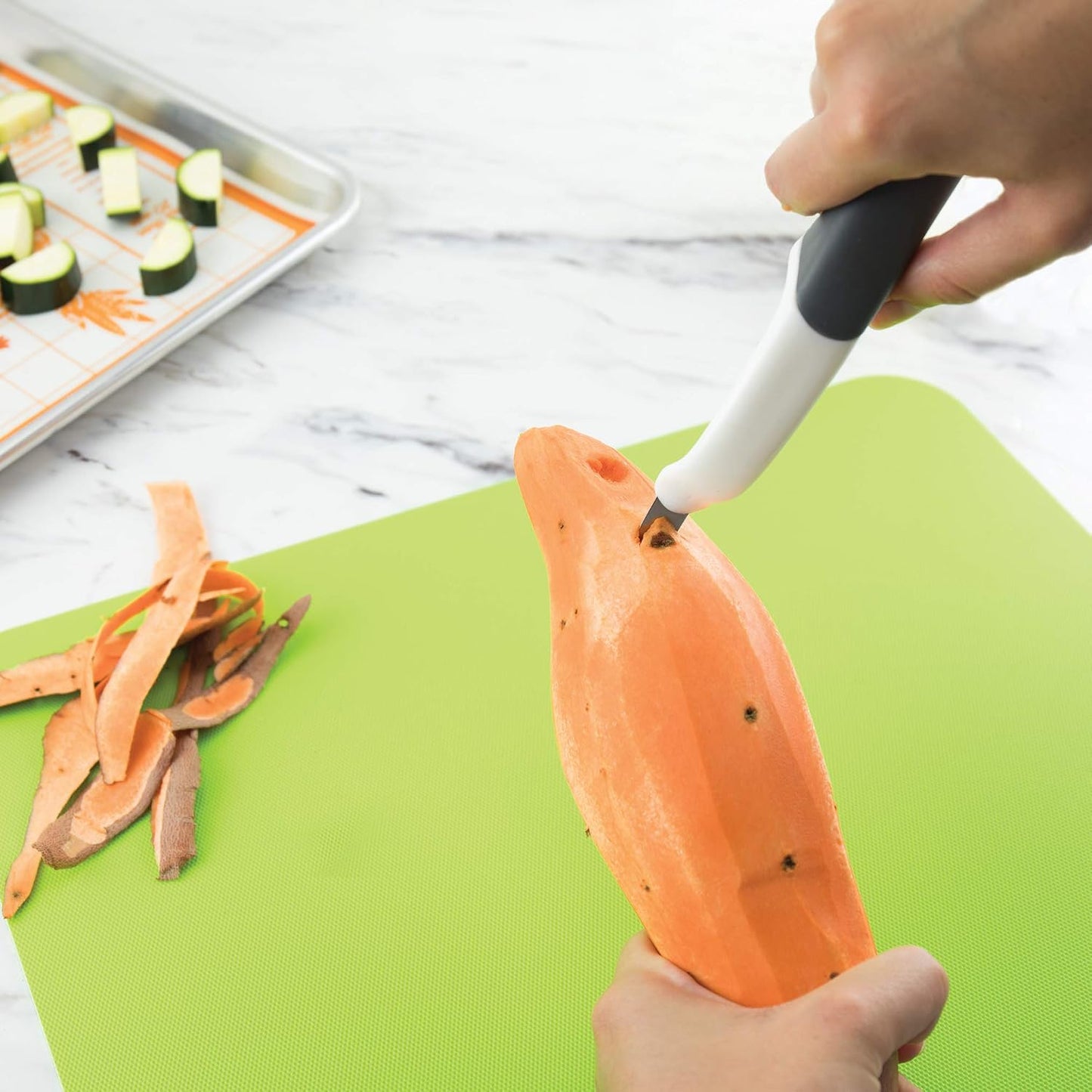 Tovolo Vegetable Peeler with Ultra Sharp Stainless Steel Swivel Blade Non Slip Handle, Multi Functional Dishwasher Safe Kitchen Wide Ribbon Potato Peeler for Fruit Veggies Carrots Apples, Oatmeal