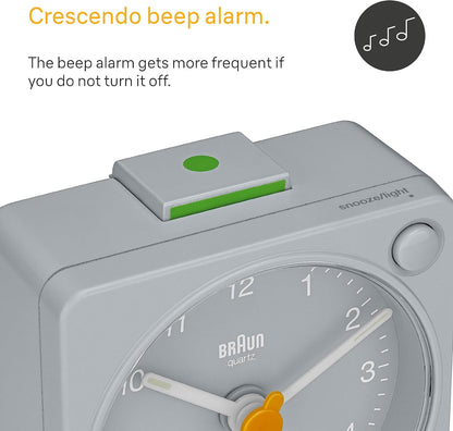 Braun Classic Travel Analogue Alarm Clock with Snooze and Light, Compact Size, Quiet Quartz Movement, Crescendo Beep Alarm in Black and White, Model BC02XBW.