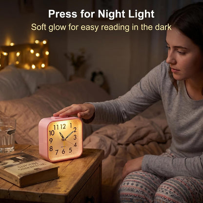 Small Analog Alarm Clock Battery Operated with Warm Glow Nightlight, Silent Non-Ticking Quartz Desk Clock, Easy-to-Read Dial, Battery Powered Travel Table Clock for Bedroom, Students, Office（Pink)