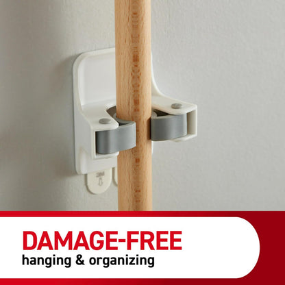 Command Large White Broom Grippers, 2 Broom Grippers, 4 Strips | Damage-Free Hanging Wall Mount Broom and Mop Holder, No Tools Holiday Cleaning Organizer, Holds up to 4 lb