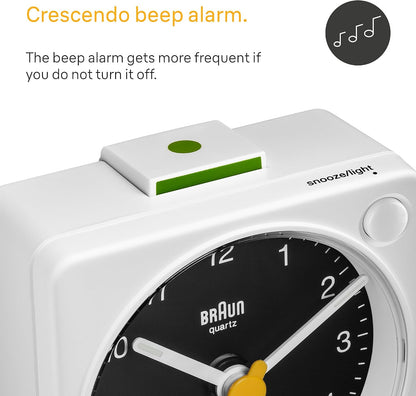 Braun Classic Travel Analogue Alarm Clock with Snooze and Light, Compact Size, Quiet Quartz Movement, Crescendo Beep Alarm in Black and White, Model BC02XBW.
