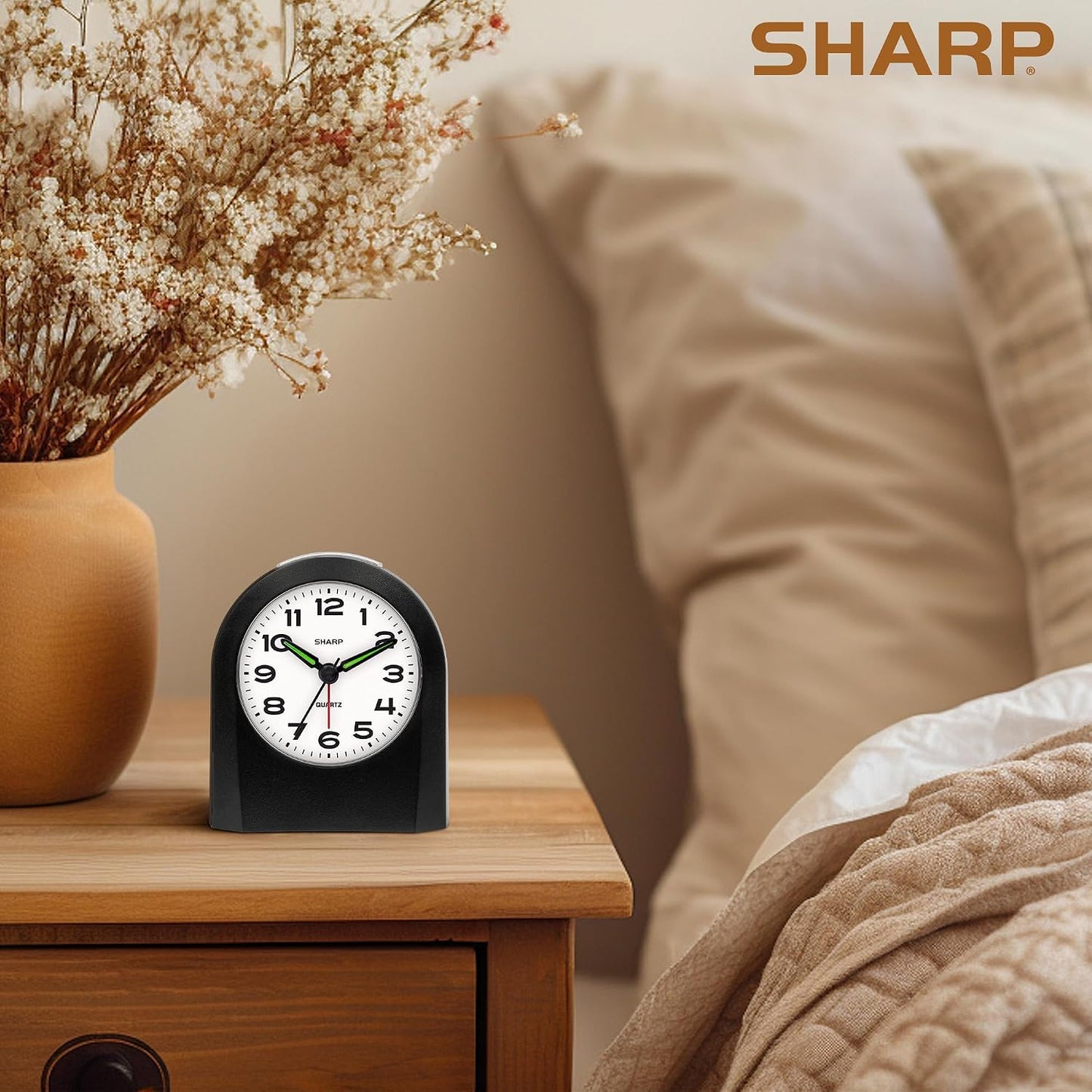 Sharp Battery-Powered Analog Alarm Clock, Silent Sweep, Snooze and Light | Silent no-tick movement; Ascending beep alarm; Gentle wake; Snooze; On-demand light; Compact size; Battery operated; Black