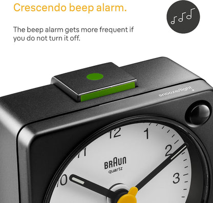 Braun Classic Travel Analogue Alarm Clock with Snooze and Light, Compact Size, Quiet Quartz Movement, Crescendo Beep Alarm in Black and White, Model BC02XBW.