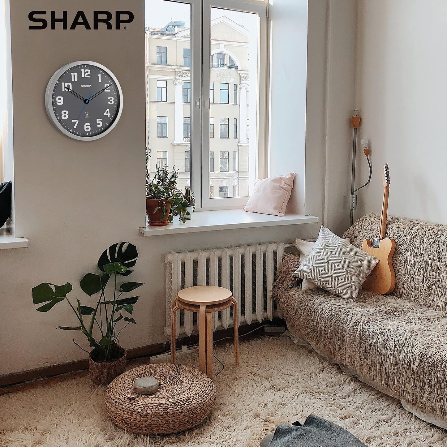 Sharp 12-Inch Atomic Wall Clock, Battery Operated, White with Black Frame | Self-setting atomic time; Easy-read analog face; Automatic time adjustment; Simple setup; Versatile home or office style